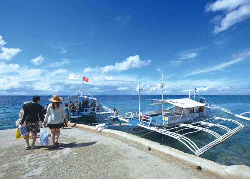 Cebu: Mactan Island Hopping Boat Tour with Lunch - Nalusuan Island: sandbar strolling and clear-water snorkeling