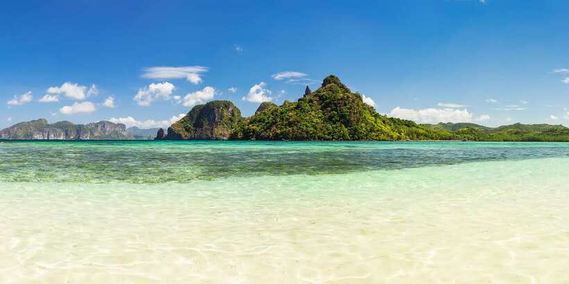 Coron Island Escapade: A Tropical Feast & Adventure - Bulog Dos Island (Cauayan): the sandbar moment for wading and photos