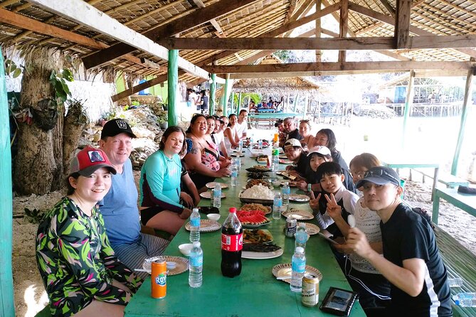 Coron Island Escapade Group Tour with Island Lunch - Malcapuya Island: a one-hour dose of white sand and snorkeling-friendly water