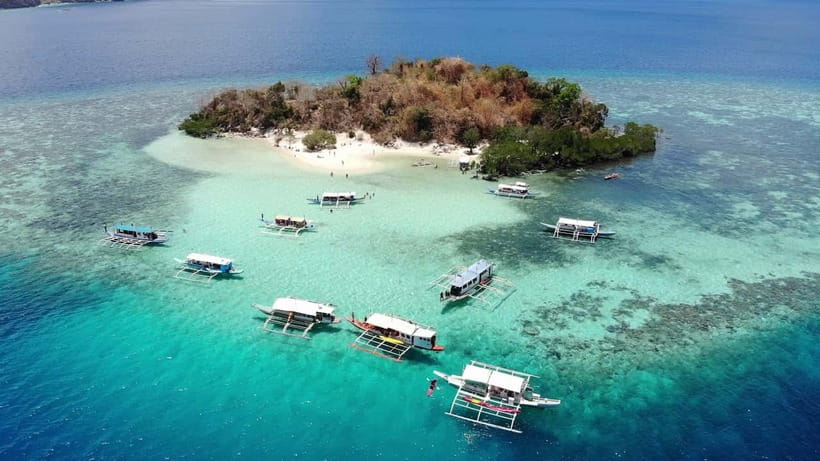 From Coron: Island Hopping Boat Day Trip with Buffet Lunch - The shoreline cruise: light snacks, planned scenery, and built-in breaks