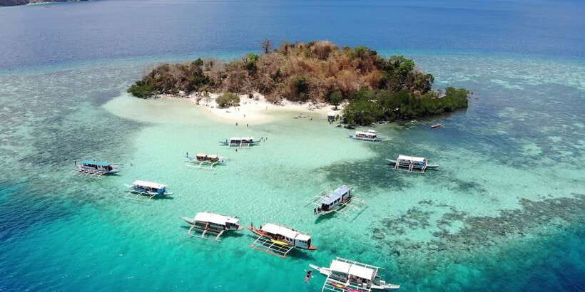 From Coron: Island Hopping Boat Day Trip with Buffet Lunch - Sunset Beach and CYC Beach: the payoff for the in-between cruising
