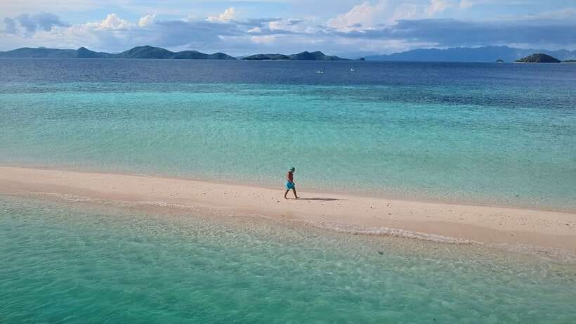 From Coron: Private Island-Hopping Cruise with Lunch - Malcapuya: Shallow Turquoise Water and a Coral-Watching Option