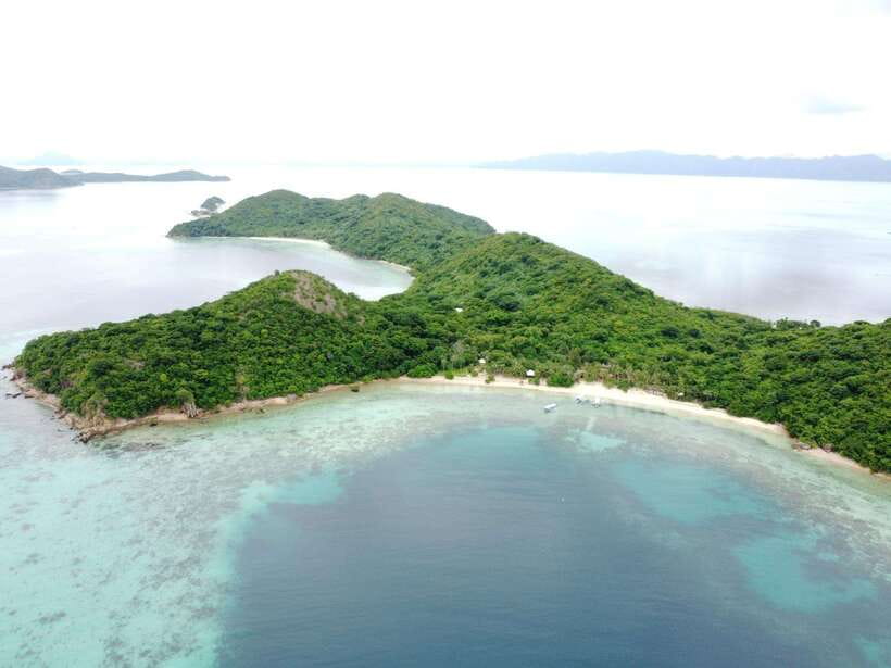 From Coron Town: Beaches and Islands Boat Tour with Lunch - Malcapuya Island: fine sand, clear water, and lunch built in