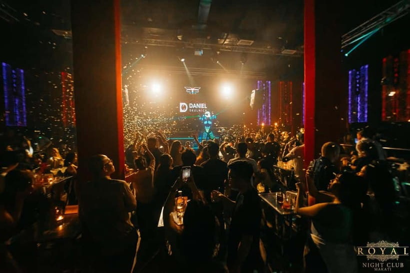 Makati Nightlife: VIP Access to Clubs, Rooftops & Go-Go Bars - The Filling Station photo stop and Bourbon Bar concert break