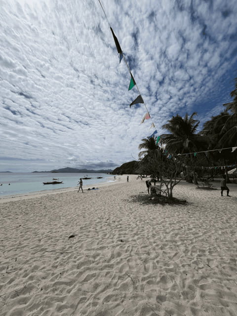 Private Boat for Culion Island Escapade Tour - Malcapuya Beach: the white-sand first stop with clear water