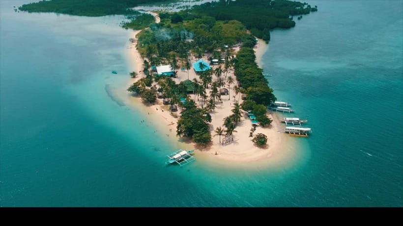 Puerto Princesa: Cowrie Island Guided Day Tour with Meal - Cowrie Island in Honda Bay: close, calm, and easy to fit in